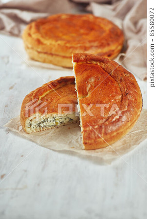 Selective Focus Traditional meat closed pie on the table. 85580072