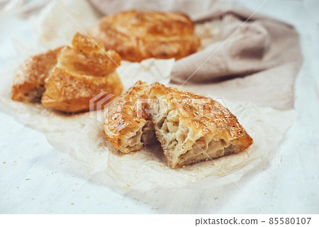 Puff pastry, vertuta or placinda baked goods with potatoes Puff pastry, vertuta or placinda baked goods with potatoes 85580107