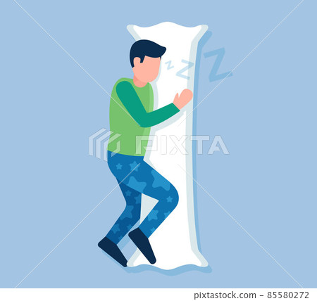 man in pajamas hugs a long pillow. 85580272