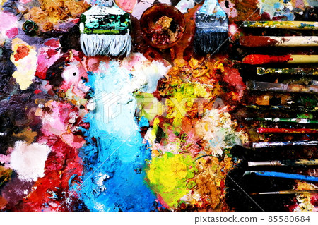 Close up paint brushes on a color full painter in black ground. 85580684
