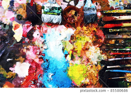 Close up paint brushes on a color full painter in black ground. Close up paint brushes on a color full painter in black ground. 85580686