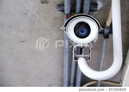 CCTV security camera operating in home. Image of CCTV security camera on background. cctv ball on safe ground. CCTV security camera operating in home. Image of CCTV security camera on background. cctv ball on safe ground. 85580809
