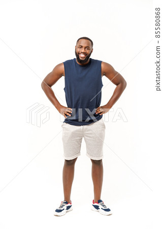 Young fitness african black man in sport wear cheering carefree isolated over white background. Young fitness african black man in sport wear cheering carefree isolated over white background. 85580868