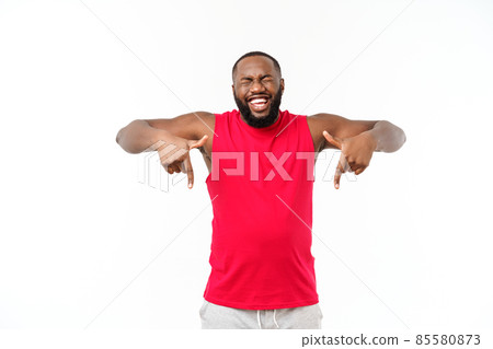 Young african american sport man pointing finger with surprised, feels successful and prosperous Young african american sport man pointing finger with surprised, feels successful and prosperous 85580873