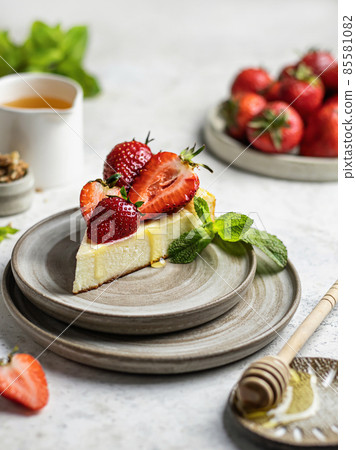 Cottage cheese casserole garnished with fresh strawberries and mint leaves for breakfast Cottage cheese casserole garnished with fresh strawberries and mint leaves for breakfast 85581082
