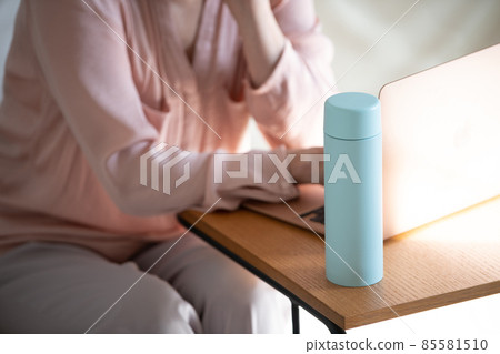Female working from home using my bottle Female working from home using my bottle 85581510