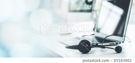 Headset and customer support equipment at call center ready for actively service 85583002