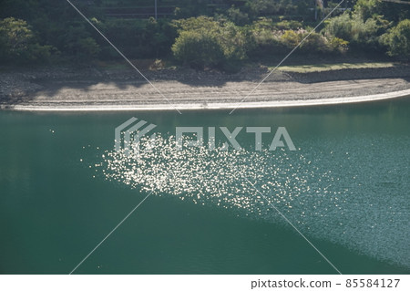 Glittering water surface of Chang'an dam lake Glittering water surface of Chang'an dam lake 85584127