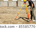 Land and house surveyor doing survey 85585770