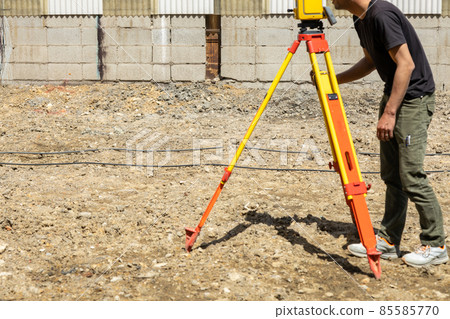 Land and house surveyor doing survey 85585770