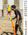 Land and house surveyor doing survey 85585772