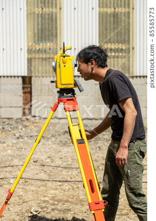 Land and house surveyor doing survey Land and house surveyor doing survey 85585773