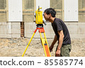 Land and house surveyor doing survey 85585774