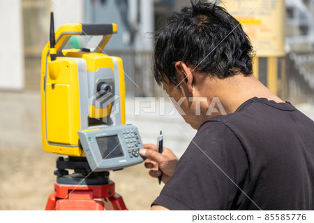 Land and house surveyor doing survey Land and house surveyor doing survey 85585776