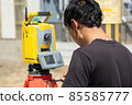 Land and house surveyor doing survey 85585777