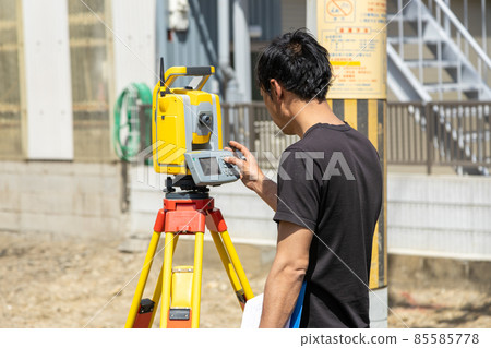 Land and house surveyor doing survey Land and house surveyor doing survey 85585778