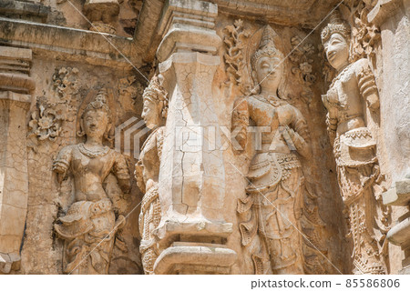 The ancient stucco figures decorated outside the wall of Viharn in Wat Jed Yod of Chiang Mai province of Thailand. This stucco reliefs is the most beautiful figures in traditional Lanna style. The ancient stucco figures decorated outside the wall of Viharn in Wat Jed Yod of Chiang Mai province of Thailand. This stucco reliefs is the most beautiful figures in traditional Lanna style. 85586806