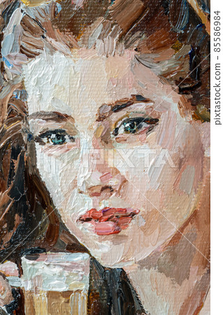 .The girl in the cafe drinks coffee. 85586984
