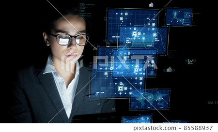 Woman looking at hologram screen Woman looking at hologram screen 85588937