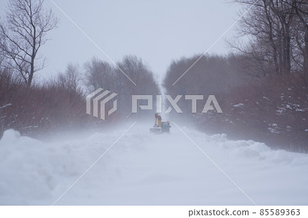 Snow removal work in a blizzard 85589363
