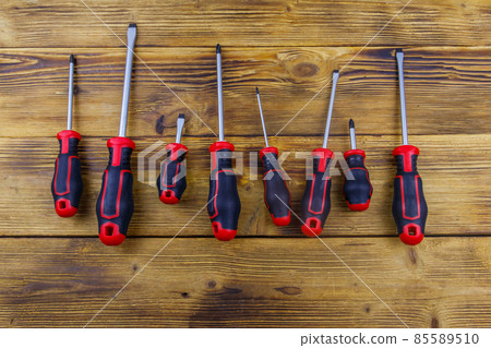 Set of screwdrivers on wooden background. Top view Set of screwdrivers on wooden background. Top view 85589510