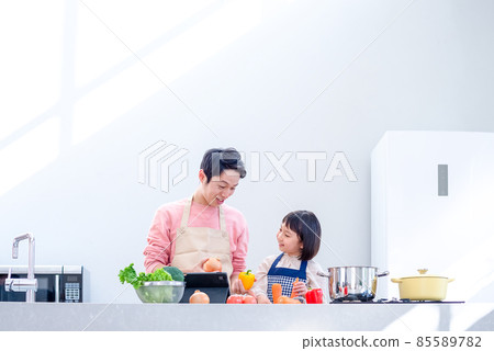 Cooking together with dad and girl Kitchen with light Cooking together with dad and girl Kitchen with light 85589782