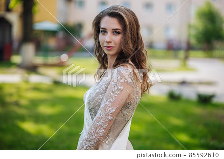 Beautiful schoolgirl in dress at the prom at school. Beautiful schoolgirl in dress at the prom at school. 85592610