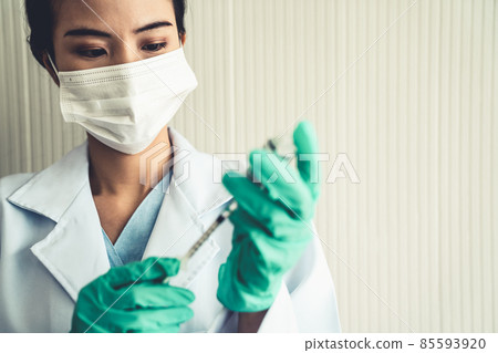 Skillful doctor prepare vaccine proficiently before injection 85593920
