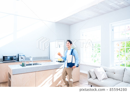 A man who came back from your errand, a kitchen with light A man who came back from your errand, a kitchen with light 85594280