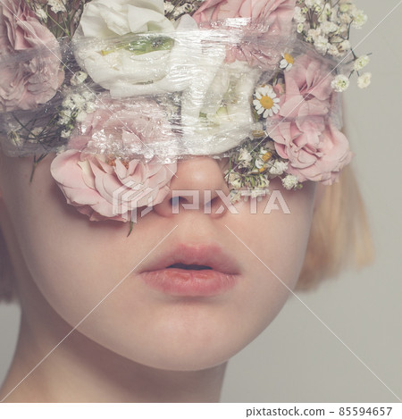 Beautiful teenager girl face with gentle flowers on closed eyes portrait 85594657