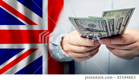 UK national flag and US dollars banknote. Business, finance, politics and corruption concept 85594663