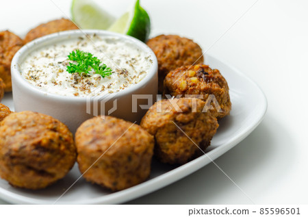 Falafels, gently spiced blend of sweet potato, chickpeas and onion with a sour dip Falafels, gently spiced blend of sweet potato, chickpeas and onion with a sour dip 85596501