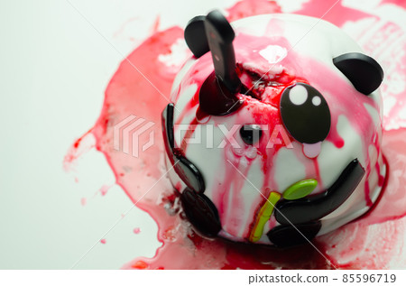 Layered biscuit cake in the shape of a panda decorated for halloween party, scary sweet dessert 85596719