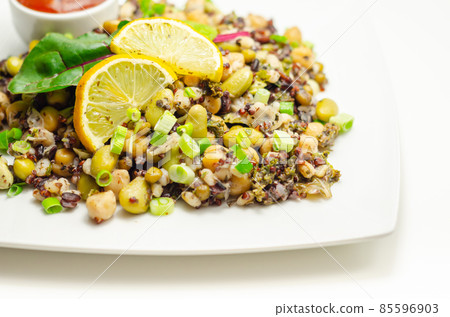 Cooked edamame beans, chickpeas, pearl barley, red quinoa, mung beans and black rice in a refreshing lemon dressing Cooked edamame beans, chickpeas, pearl barley, red quinoa, mung beans and black rice in a refreshing lemon dressing 85596903