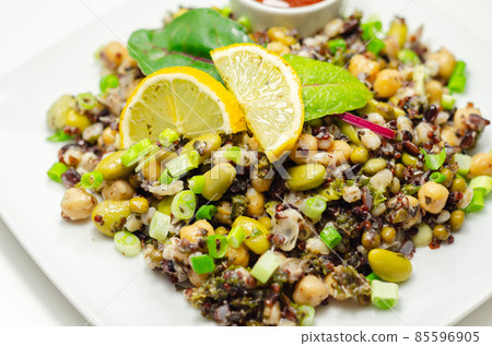 Cooked edamame beans, chickpeas, pearl barley, red quinoa, mung beans and black rice in a refreshing lemon dressing Cooked edamame beans, chickpeas, pearl barley, red quinoa, mung beans and black rice in a refreshing lemon dressing 85596905