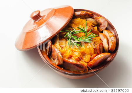 Traditional Polish dish called bigos made of sauerkraut, sausage and mushrooms, food served warm in a ceramic bowl Traditional Polish dish called bigos made of sauerkraut, sausage and mushrooms, food served warm in a ceramic bowl 85597003