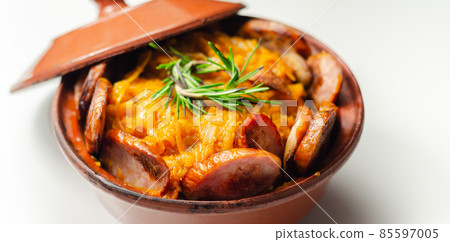 Traditional Polish dish called bigos made of sauerkraut, sausage and mushrooms, food served warm in a ceramic bowl Traditional Polish dish called bigos made of sauerkraut, sausage and mushrooms, food served warm in a ceramic bowl 85597005