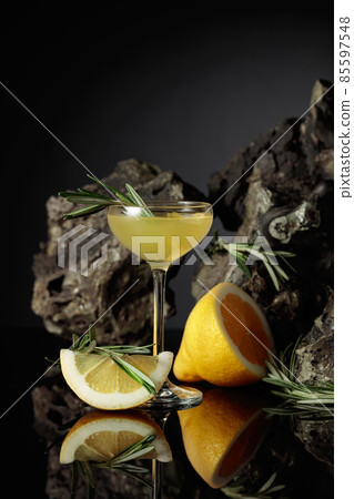 Traditional homemade lemon liqueur limoncello on the black background. 85597548