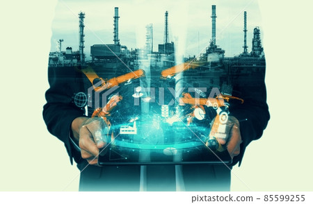 Mechanized industry robot arm and factory worker double exposure 85599255