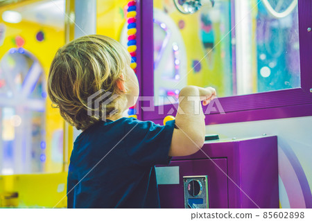 Boy playing with kinetic sand in preschool. The development of fine motor concept. Creativity Game concept Boy playing with kinetic sand in preschool. The development of fine motor concept. Creativity Game concept 85602898
