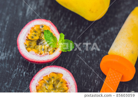 Homemade ice cream from mango and passion fruit. Popsicle 85603059