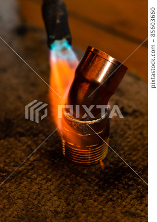 Copper soldering, work process of installation and soldering of copper pipes to the heating fireplace. 85603660
