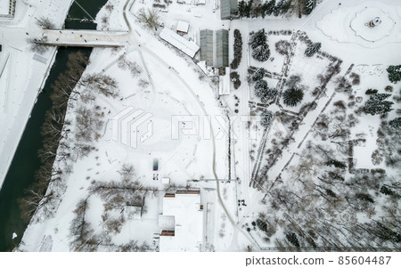 Small park with bare trees covered with snow. Aerial view to winter park in Yekaterinburg 85604487