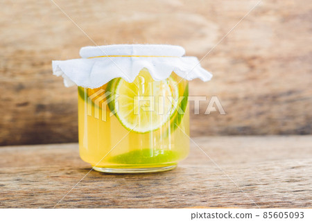 Homemade Fermented Raw Kombucha Tea Ready to Drink With orange and lime. Summer Homemade Fermented Raw Kombucha Tea Ready to Drink With orange and lime. Summer 85605093
