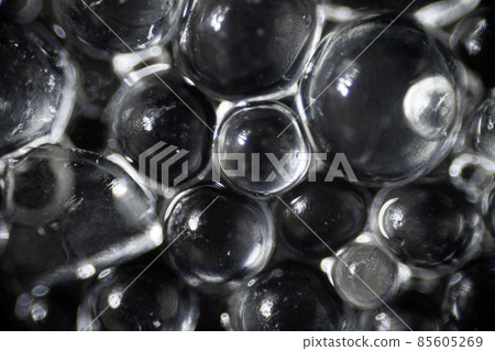 Silica gel for moisture control, absorbent particles under a light microscope, magnification 40 times 85605269