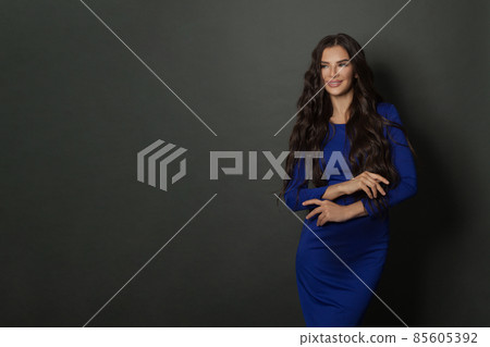 Attractive laughing woman brunette with long healthy curly hair. Attractive laughing woman brunette with long healthy curly hair. 85605392