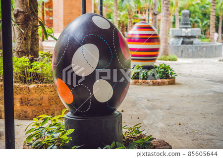 Multicolored eggs in the grass. Easter eggs hunt, outdoors. Celebrating Easter holiday Multicolored eggs in the grass. Easter eggs hunt, outdoors. Celebrating Easter holiday 85605644
