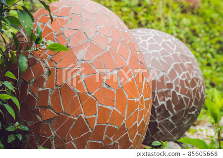 Multicolored eggs in the grass. Easter eggs hunt, outdoors. Celebrating Easter holiday 85605668