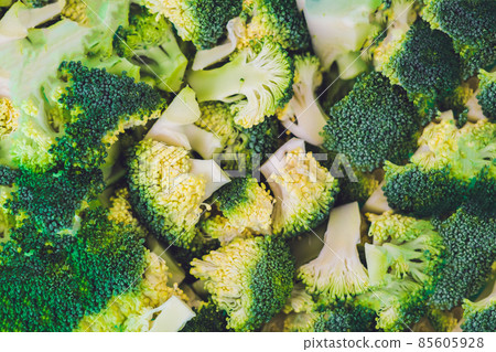 Background of sliced broccoli. Healthy green food concept Background of sliced broccoli. Healthy green food concept 85605928