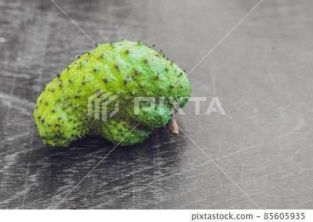 Guanabana on an old wooden background - exotic tropical fruit - regional fruits from Vietnam Guanabana on an old wooden background - exotic tropical fruit - regional fruits from Vietnam 85605935